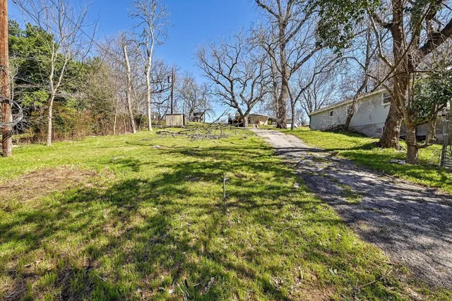 a view of yard with swimming pool