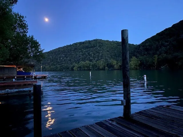 a wooden bench sitting on top of a wooden floor