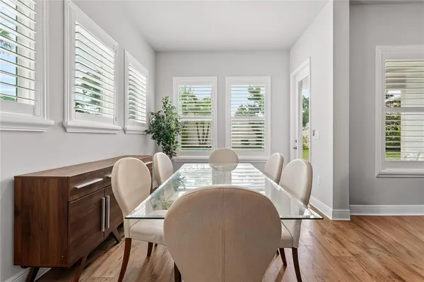 a view of a dining room with furniture window and outside view