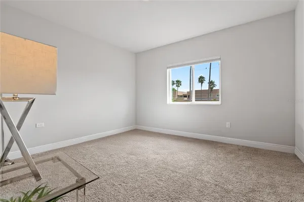 a view of an empty room with a window