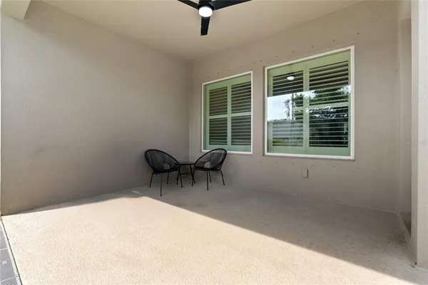 a view of a room with a table and chairs