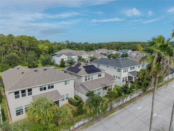an aerial view of a house with a garden