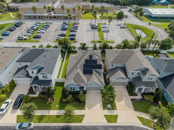 an aerial view of residential houses with outdoor space