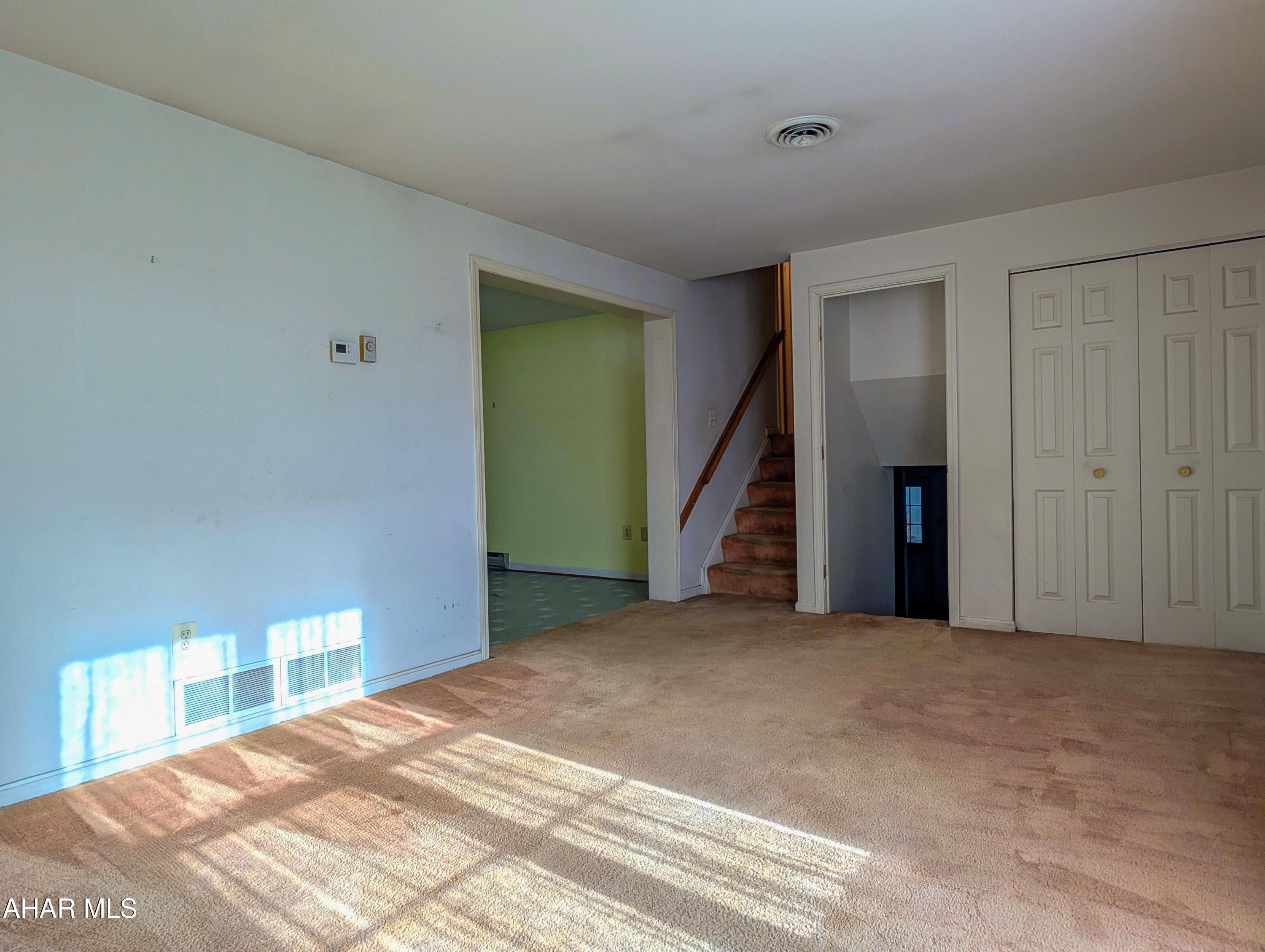 147 Pine Street Hyndman, PA 15545 - Photo 15 of 44 a view of an empty room with a fireplace