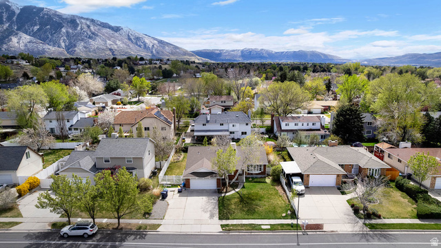 1822 East 9800th Street South Sandy, UT 84092 - Photo 7 of 38 Aerial view of residential area with a mountain backdrop
