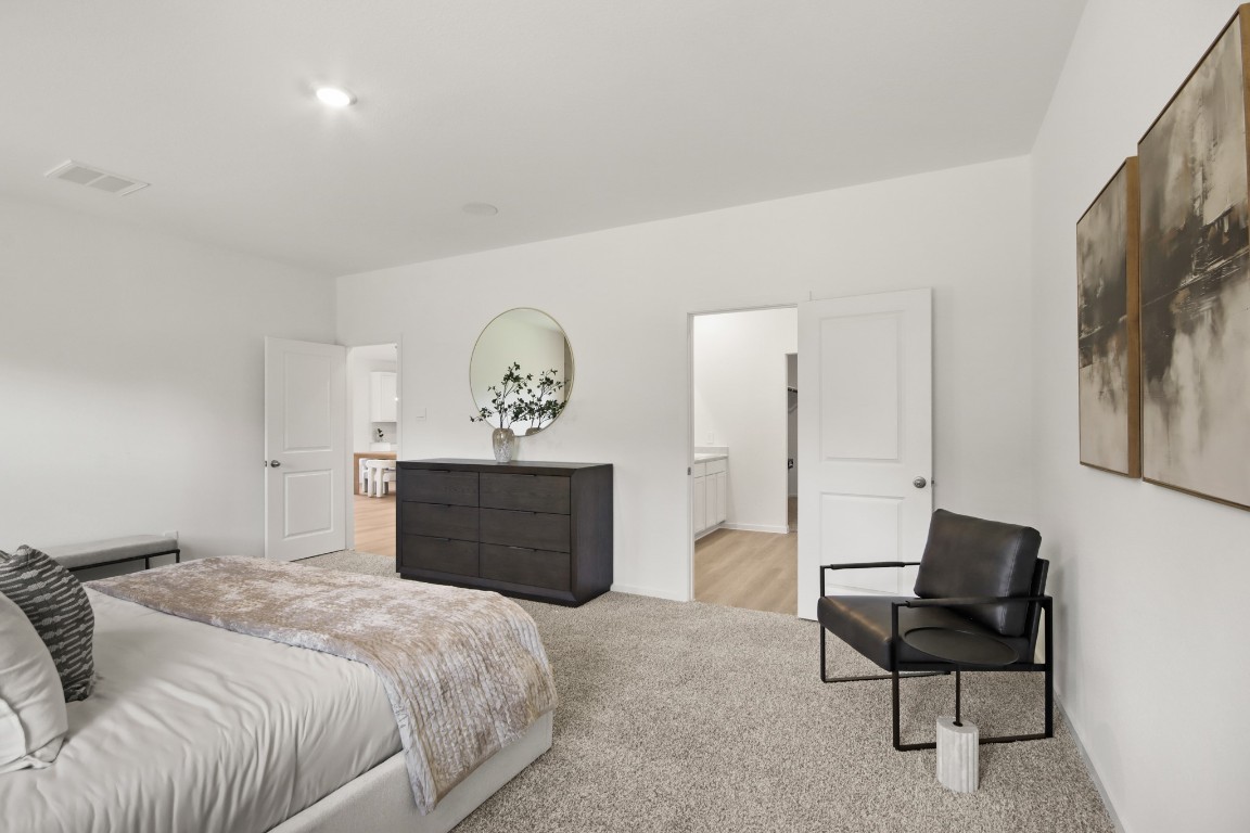 540 Wax Myrtle Way Hockley, TX 77447 - Photo 12 of 25 a bedroom with a bed and chair