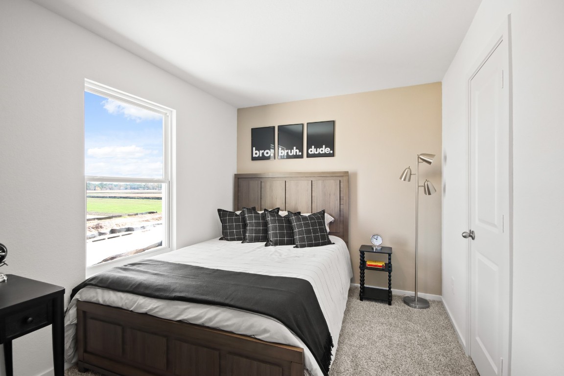 540 Wax Myrtle Way Hockley, TX 77447 - Photo 19 of 25 a bedroom with a bed and a window