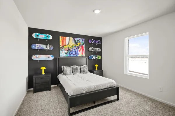 a bedroom with a bed and furniture