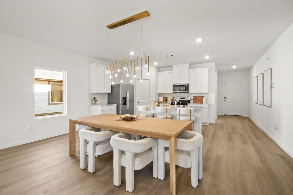 540 Wax Myrtle Way Hockley, TX 77447 - Photo 5 of 25 a view of a dining room with furniture and wooden floor
