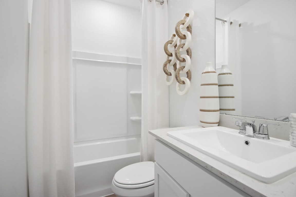 540 Wax Myrtle Way Hockley, TX 77447 - Photo 9 of 25 a bathroom with a sink a toilet and shower