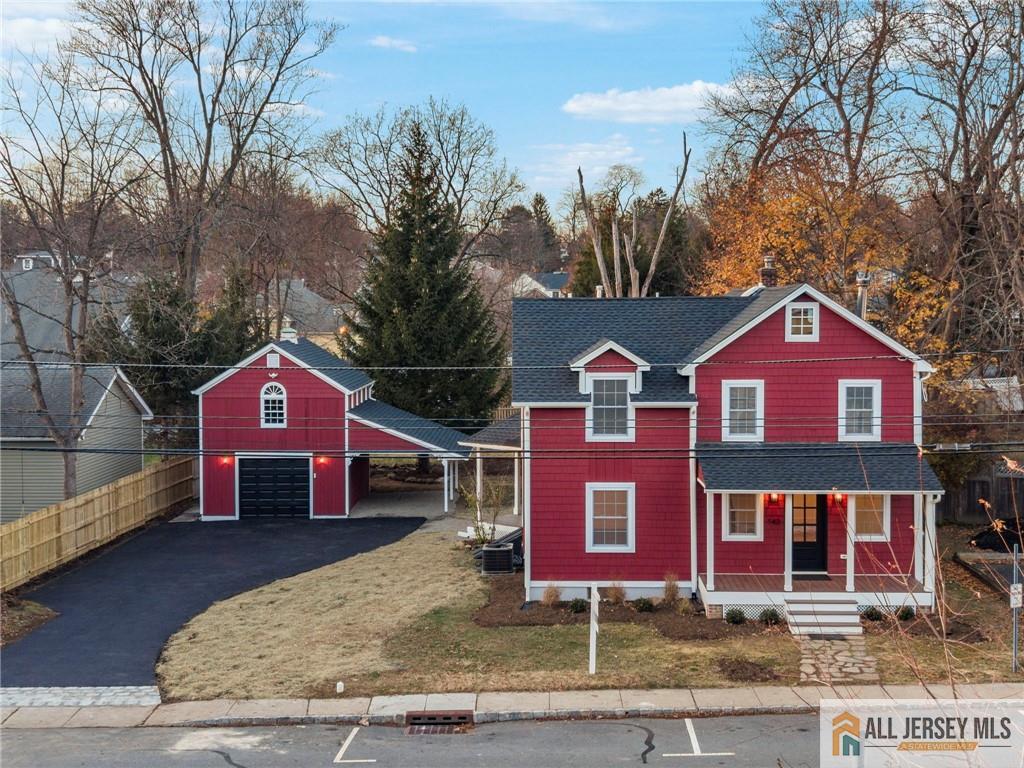 143 Maple Avenue Chester, NJ 07930 - Photo 1 of 52 a front view of a house with a yard and garage