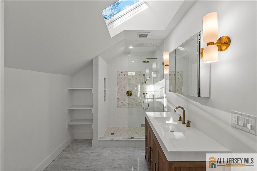 143 Maple Avenue Chester, NJ 07930 - Photo 12 of 52 a bathroom with a sink a toilet and shower