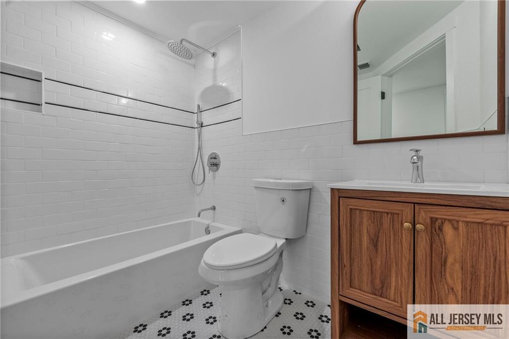 143 Maple Avenue Chester, NJ 07930 - Photo 16 of 52 a bathroom with a sink a toilet and shower