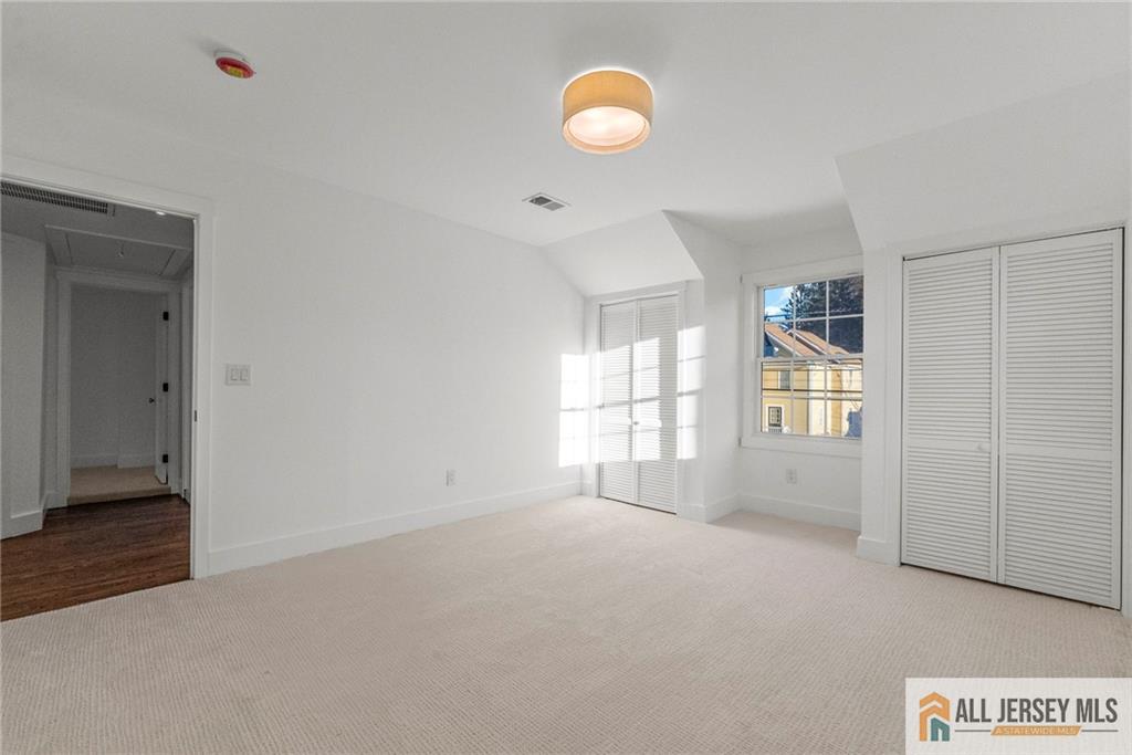 143 Maple Avenue Chester, NJ 07930 - Photo 17 of 52 a view of an empty room with a window