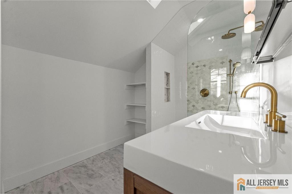 143 Maple Avenue Chester, NJ 07930 - Photo 18 of 52 a kitchen with a sink and a refrigerator