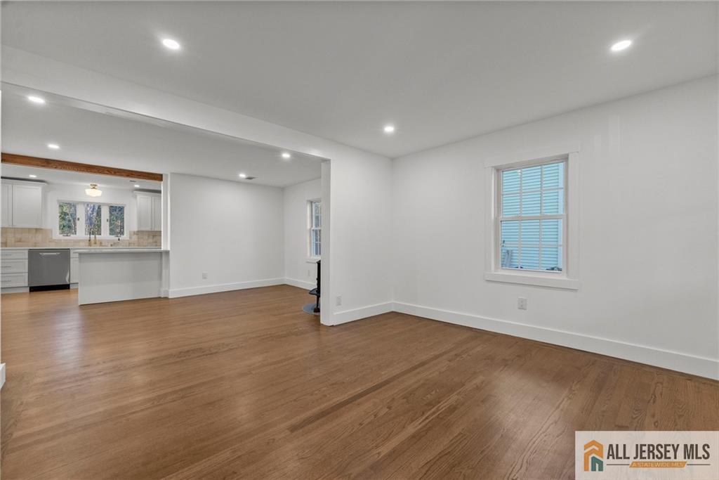143 Maple Avenue Chester, NJ 07930 - Photo 26 of 52 an empty room with wooden floor and windows