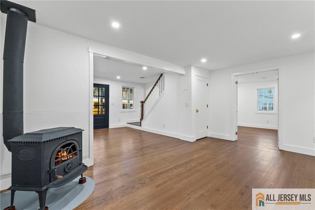 143 Maple Avenue Chester, NJ 07930 - Photo 30 of 52 a view of an empty room with wooden floor and a window