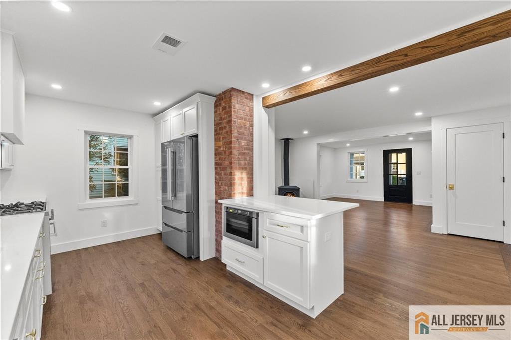 143 Maple Avenue Chester, NJ 07930 - Photo 36 of 52 a view of kitchen with stainless steel appliances granite countertop a stove top oven a sink and a refrigerator