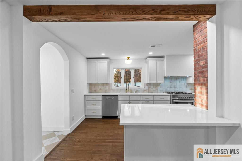 143 Maple Avenue Chester, NJ 07930 - Photo 37 of 52 a kitchen with stainless steel appliances granite countertop a sink and cabinets
