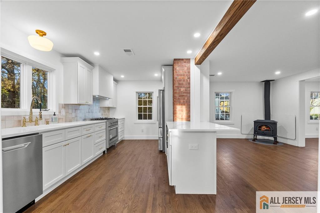 143 Maple Avenue Chester, NJ 07930 - Photo 38 of 52 a large kitchen with stainless steel appliances granite countertop a lot of counter space and a sink