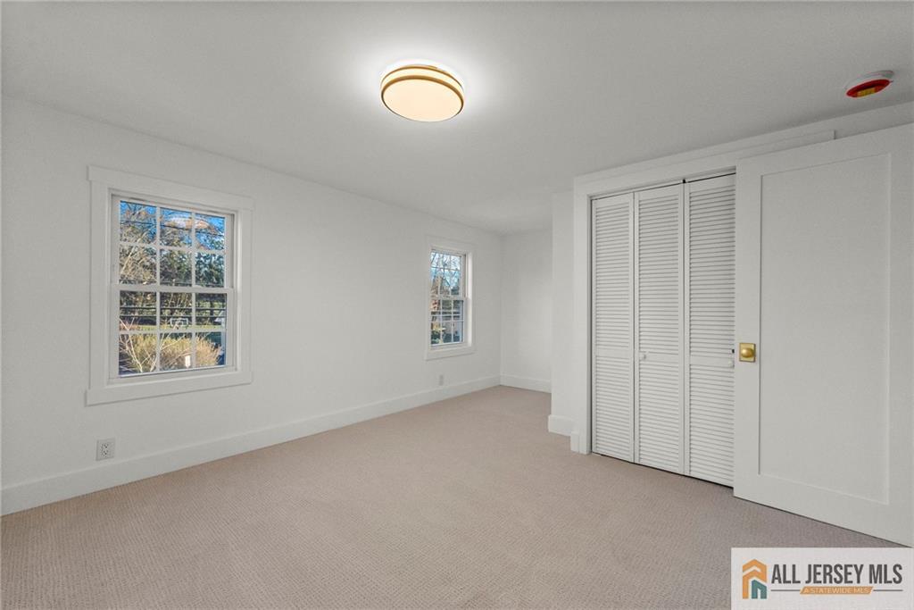 143 Maple Avenue Chester, NJ 07930 - Photo 6 of 52 an empty room with windows