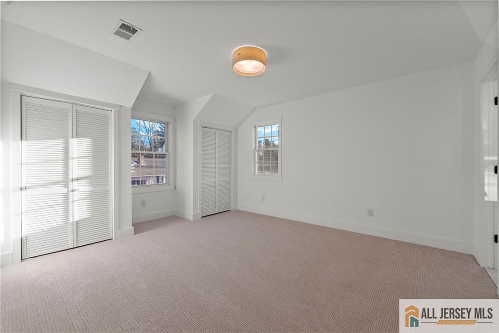 143 Maple Avenue Chester, NJ 07930 - Photo 9 of 52 an empty room with windows and closet