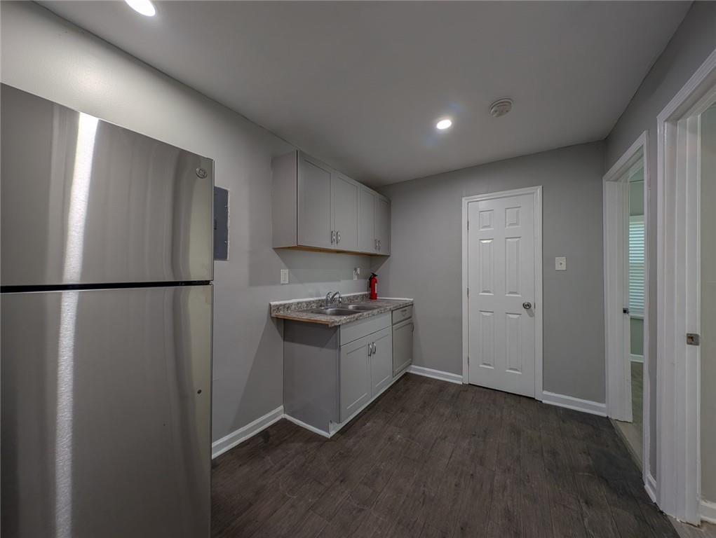 1672 Thornton Place Southwest Atlanta, GA 30315 - Photo 23 of 35 a kitchen with a refrigerator and a sink