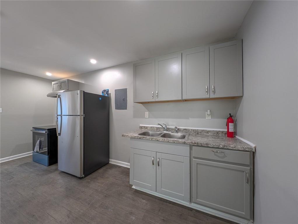 1672 Thornton Place Southwest Atlanta, GA 30315 - Photo 24 of 35 a kitchen with stainless steel appliances granite countertop a refrigerator sink and cabinets