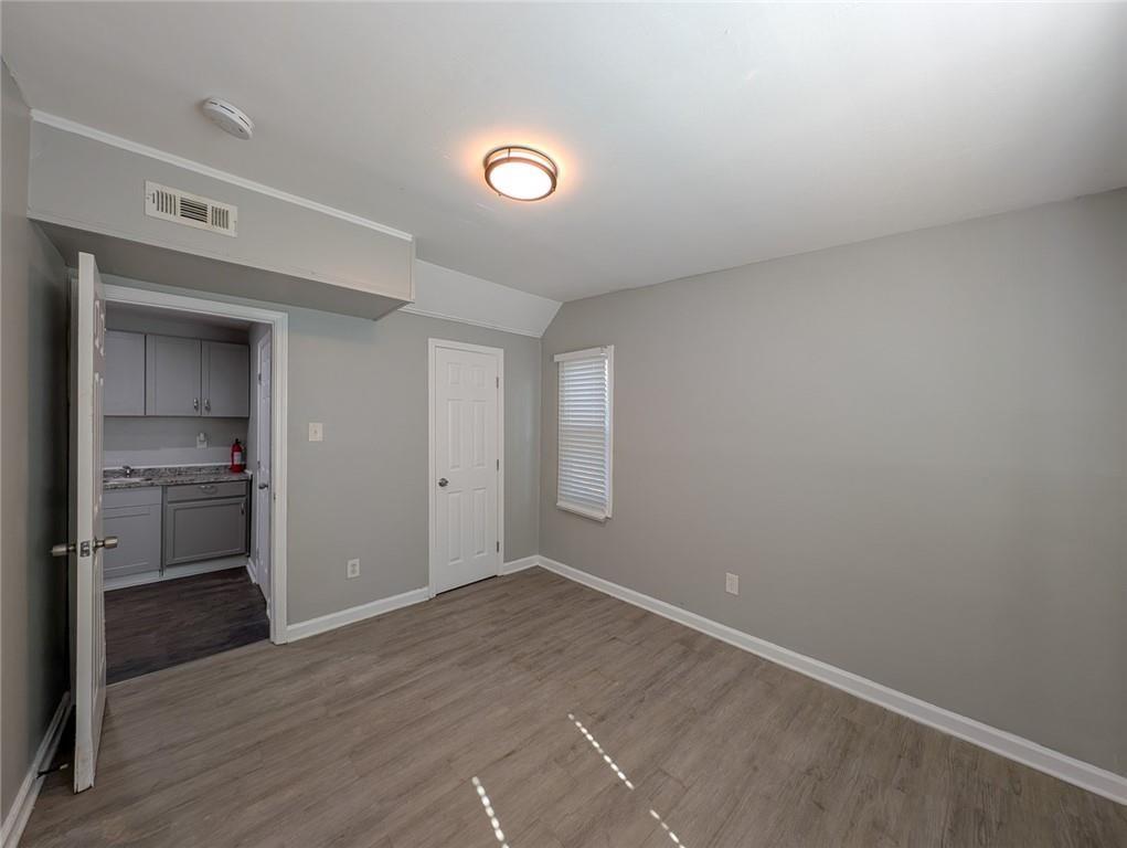 1672 Thornton Place Southwest Atlanta, GA 30315 - Photo 30 of 35 a view of a kitchen with a sink and a stove