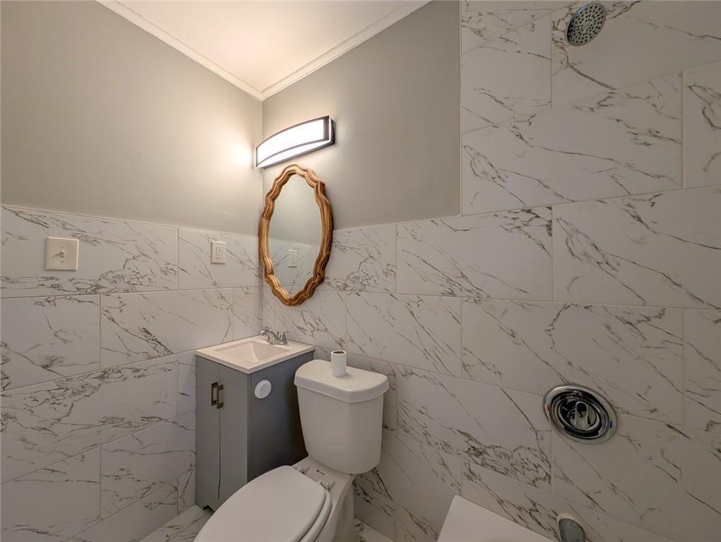1672 Thornton Place Southwest Atlanta, GA 30315 - Photo 34 of 35 a bathroom with a toilet and a sink