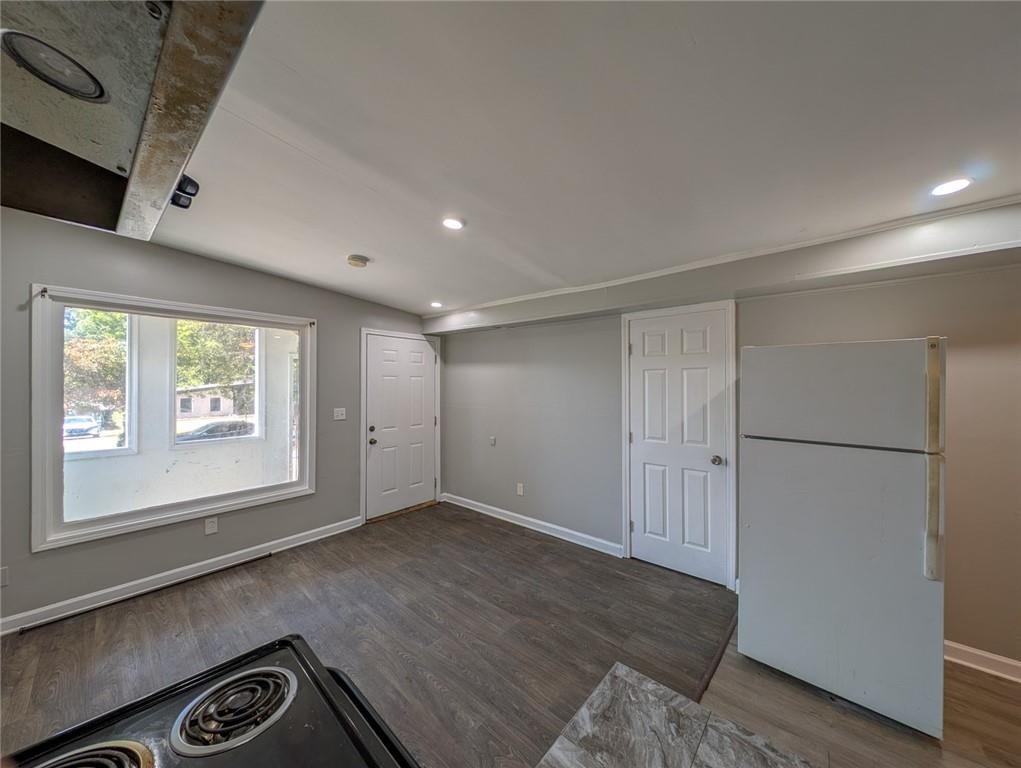 1672 Thornton Place Southwest Atlanta, GA 30315 - Photo 8 of 35 wooden floor in an empty room with a window