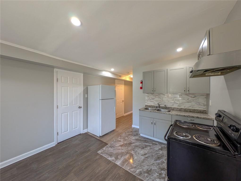 1672 Thornton Place Southwest Atlanta, GA 30315 - Photo 9 of 35 a kitchen with a stove and a refrigerator