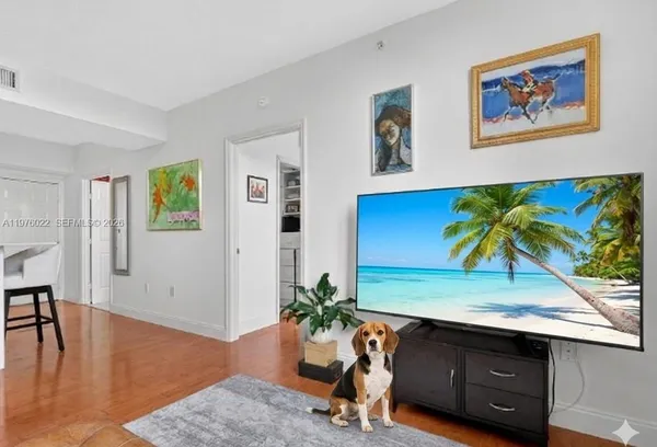 a view of a entryway with furniture and wooden floor