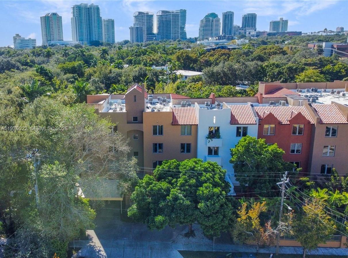 2630 Southwest 28th Street, Unit 51 Miami, FL 33133 - Photo 2 of 35 a view of a city with tall buildings