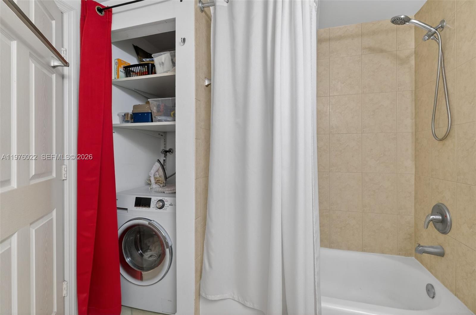 2630 Southwest 28th Street, Unit 51 Miami, FL 33133 - Photo 24 of 33 a bathroom with a bathtub and a shower