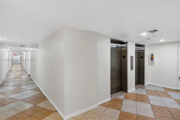 a view of a hallway with a white walls
