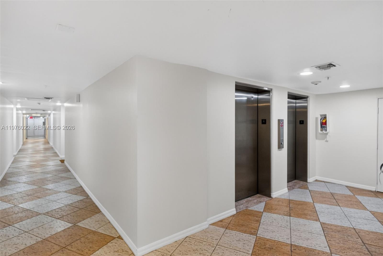2630 Southwest 28th Street, Unit 51 Miami, FL 33133 - Photo 27 of 35 a view of a hallway with a white walls
