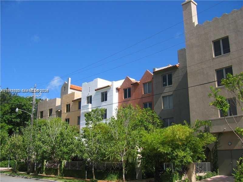 2630 Southwest 28th Street, Unit 51 Miami, FL 33133 - Photo 3 of 35 a view of buildings