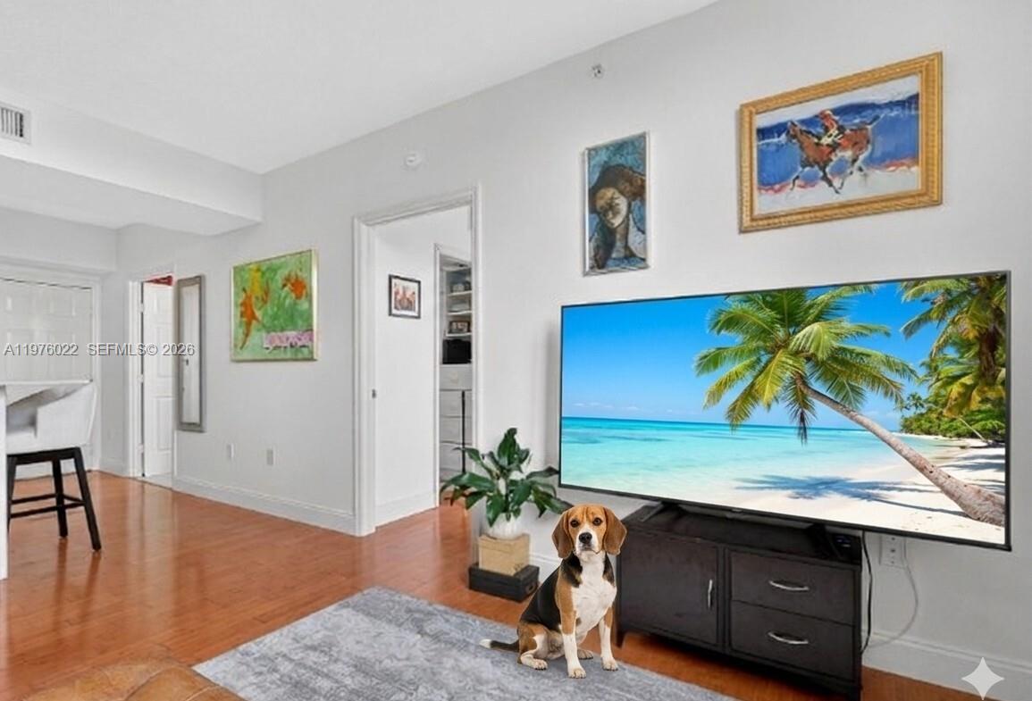 2630 Southwest 28th Street, Unit 51 Miami, FL 33133 - Photo 6 of 33 a view of a entryway with furniture and wooden floor