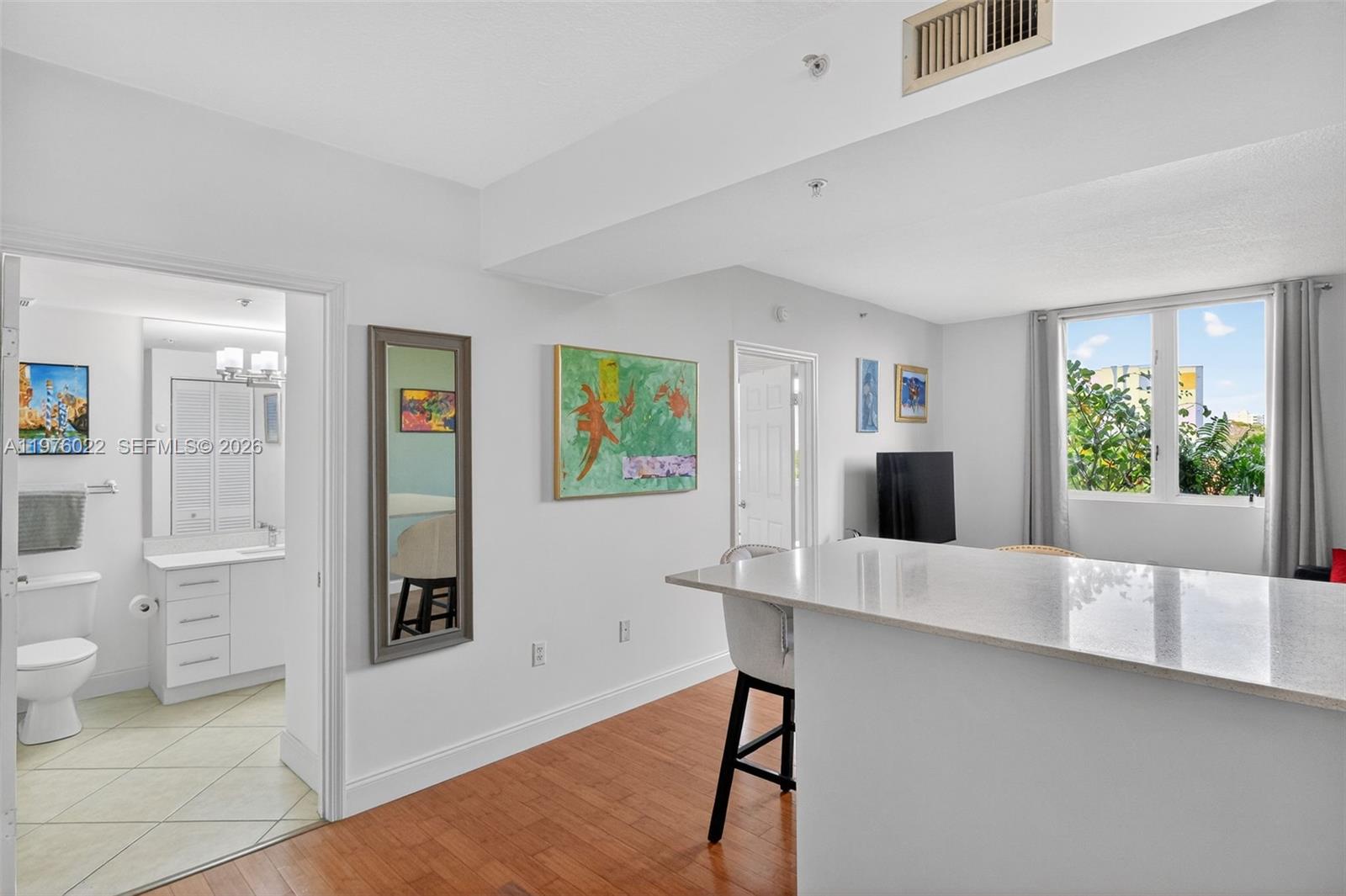 2630 Southwest 28th Street, Unit 51 Miami, FL 33133 - Photo 9 of 33 a living room with furniture and a large window