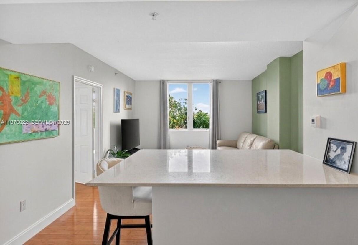 2630 Southwest 28th Street, Unit 51 Miami, FL 33133 - Photo 10 of 33 a living room with furniture and a table