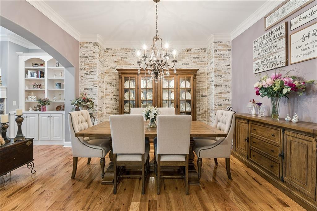 217 Trecastle Square Canton, GA 30114 - Photo 14 of 43 a view of a dining room with furniture window and wooden floor