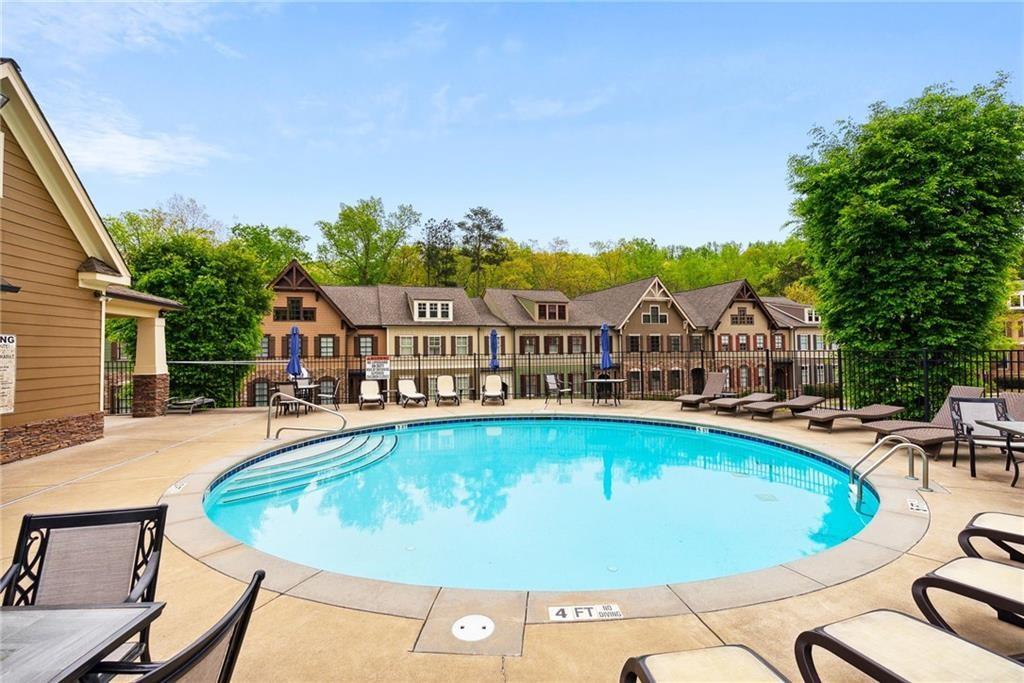 217 Trecastle Square Canton, GA 30114 - Photo 16 of 43 a view of swimming pool with seating space