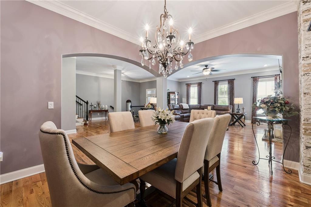 217 Trecastle Square Canton, GA 30114 - Photo 22 of 43 a view of a dining room with furniture and wooden floor