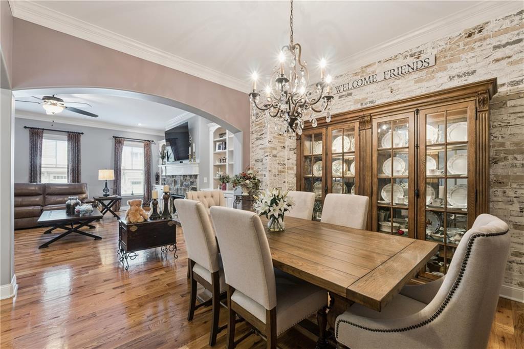 217 Trecastle Square Canton, GA 30114 - Photo 23 of 43 a view of a dining room with furniture window and wooden floor