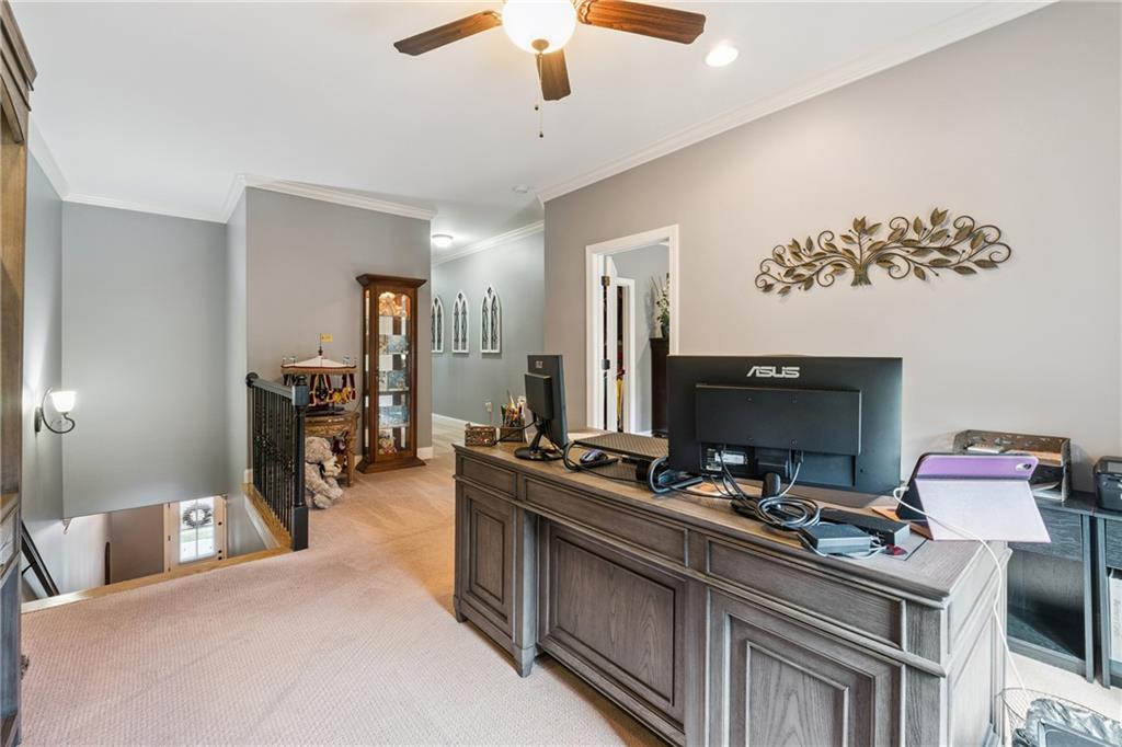 217 Trecastle Square Canton, GA 30114 - Photo 30 of 43 a bedroom with furniture and a flat screen tv