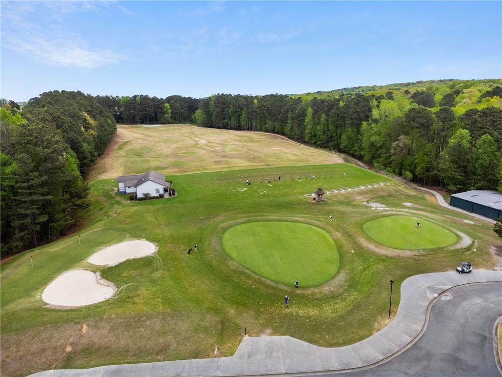 217 Trecastle Square Canton, GA 30114 - Photo 42 of 43 a view of a swimming pool with a yard and mountain view
