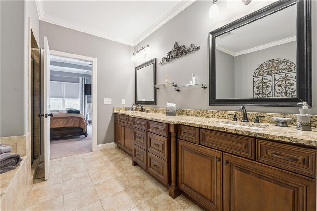 217 Trecastle Square Canton, GA 30114 - Photo 9 of 43 a spacious bathroom with a granite countertop sink mirror and