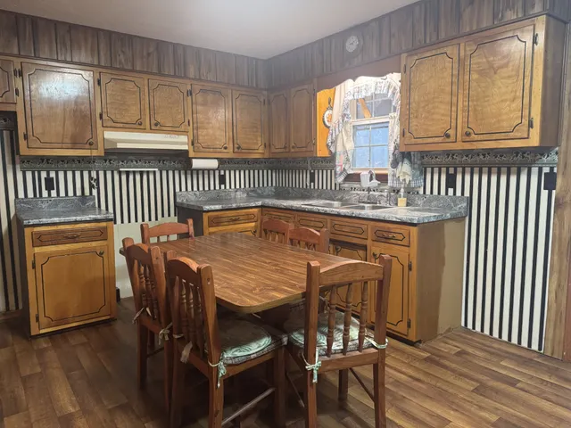 a dining room with furniture and window