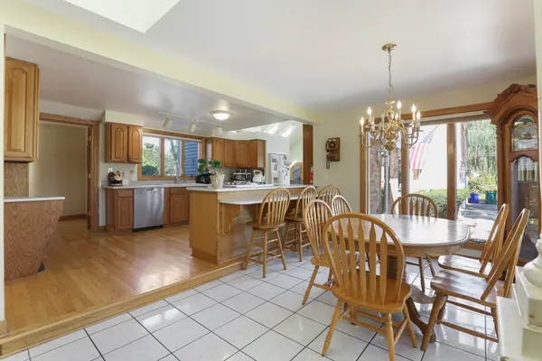 a view of a dining room with furniture window and outside view